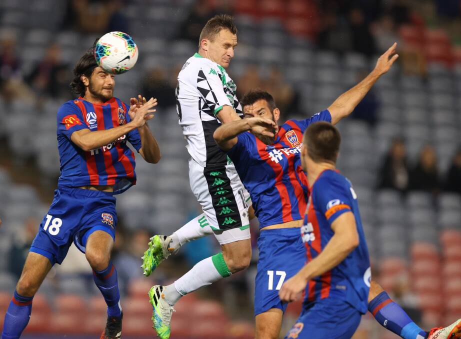 FLYING HIGH: In-form defender Johnny Koutroumbis jumps above the pack to win a header in the 1-0 win over Western United. Picture: Getty Images