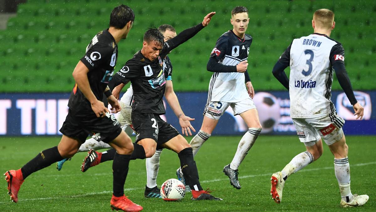 MATCH-WINNER: Pat Langlois angles a shot into the left corner to snatch the Newcastle Jets a 3-2 win over Melbourne Victory in extra-time. Picture: AAP