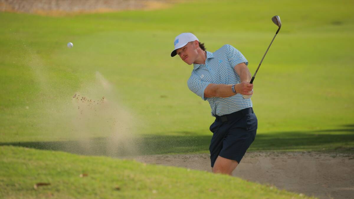 Jye Pickin blasts a shot out of the bunker during the interstate series at Southport Golf club on Monday. Picture by Dave Tease, Golf NSW