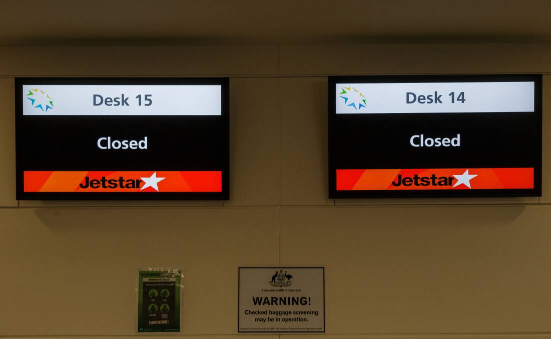 DOWNTURN: The Jetstar check-in desk at Williamtown on Thursday. The airline is still flying to Melbourne but demand is slowing again. 