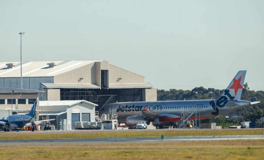 CLOSING DOWN: A Jetstar plan outside the airline's Newcastle Airport maintenance hangar on Thursday. The maintenance base is moving to Melbourne. Pictures: Max Mason-Hubers 