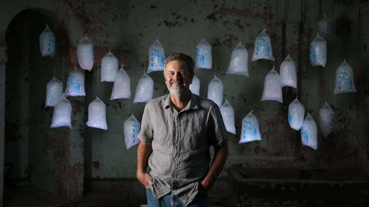  Andrew Styan at The Lock-up with  his installation of 40 bags of illuminated party ice on Friday.  Picture: Ryan Osland