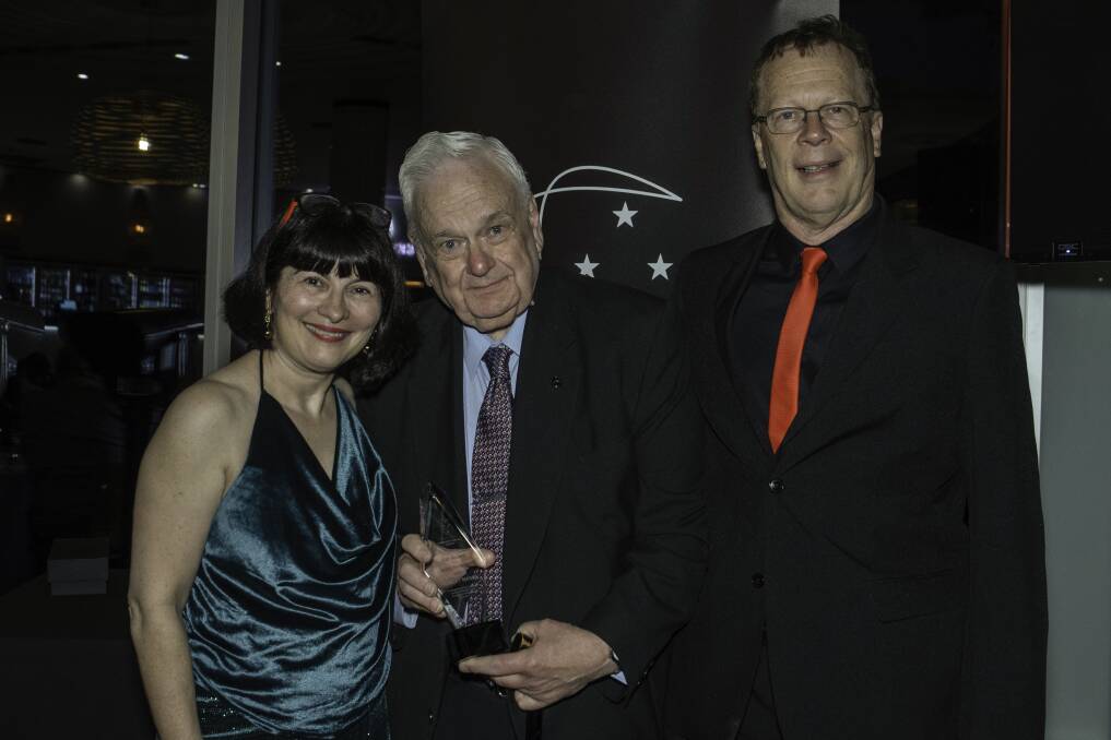 Mr Mason accepts his Lifetime Achievement Award in 2022 from Pauline Negline and Scott Seddon of Independent Cinemas Australia. Picture supplied by Independent Cinemas Australia 