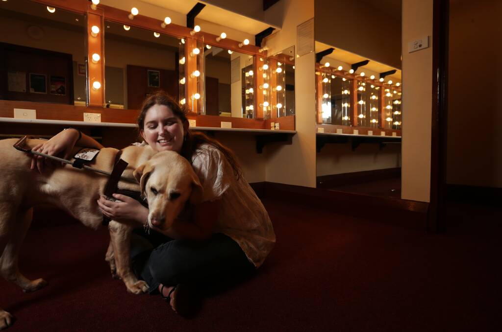 WE'RE A TEAM: Kirsten Busby, 21, and her guide dog Violet backstage at the Civic Theatre, Newcastle. Picture: Simone De Peak