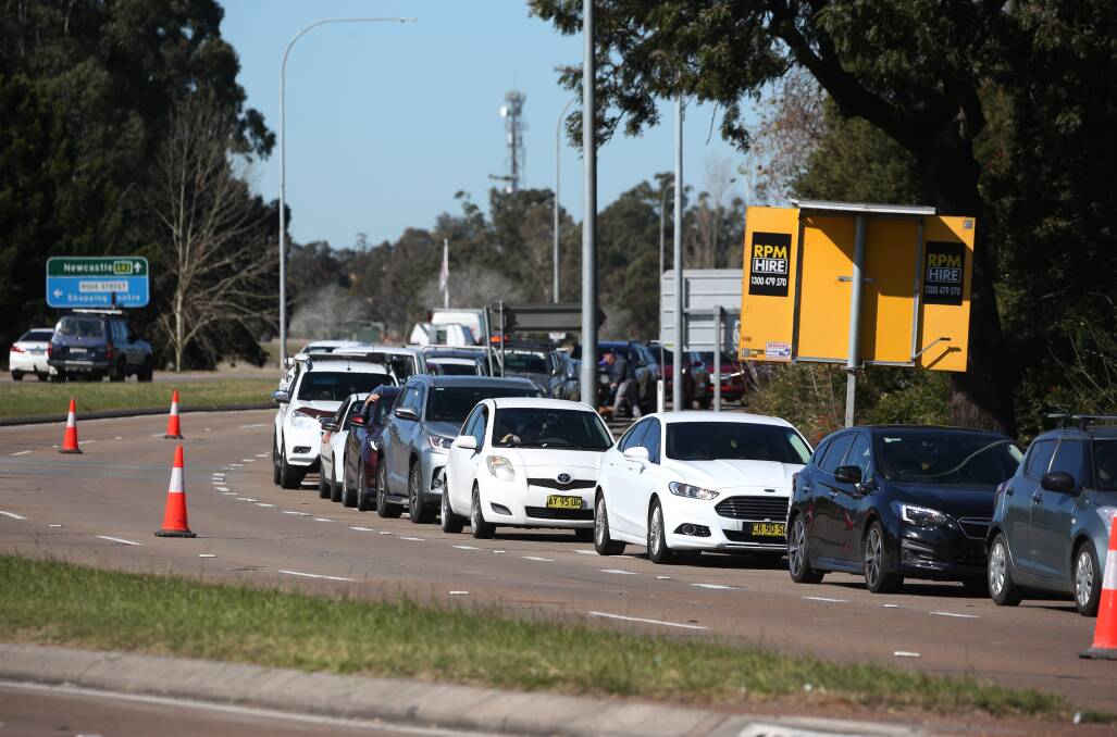 QUEUED UP: Cars in the line-up for a COVID test at Maitland Showground on Friday. Picture: Simone De Peak