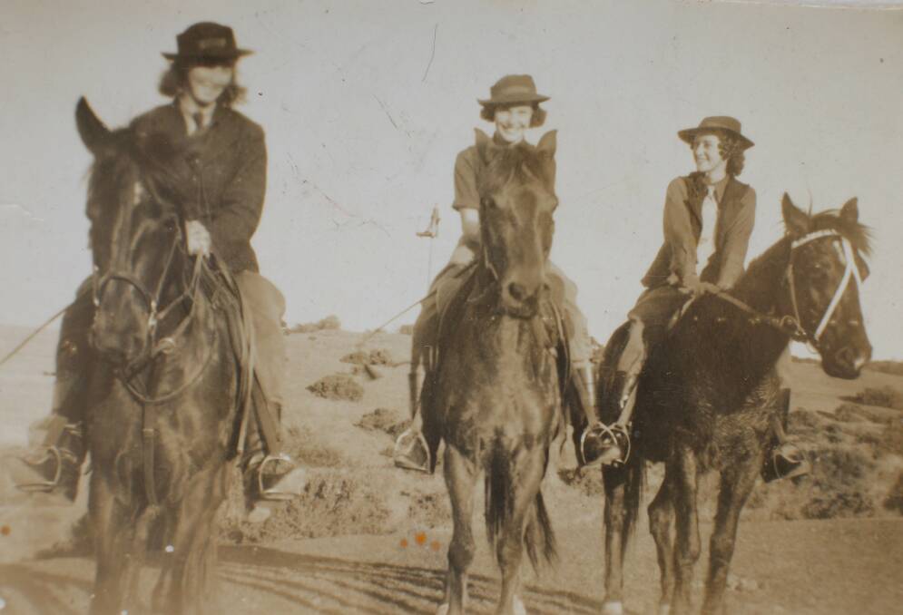 Isobel Menzies, (right) now known to close family members as 'Super Nan', riding her horse 'Pal' to Caves Beach with her friend June in 1938 at the age of 16.