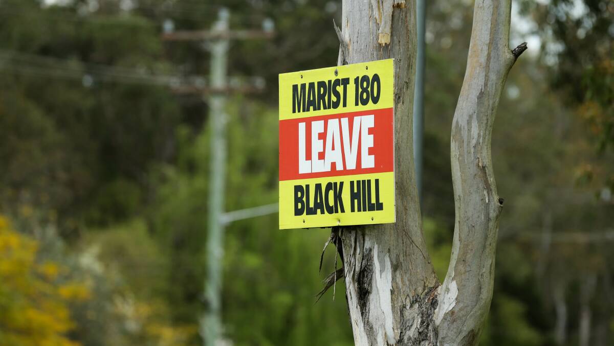 A sign pointing out the location of the Marist180 house at Black Hill.