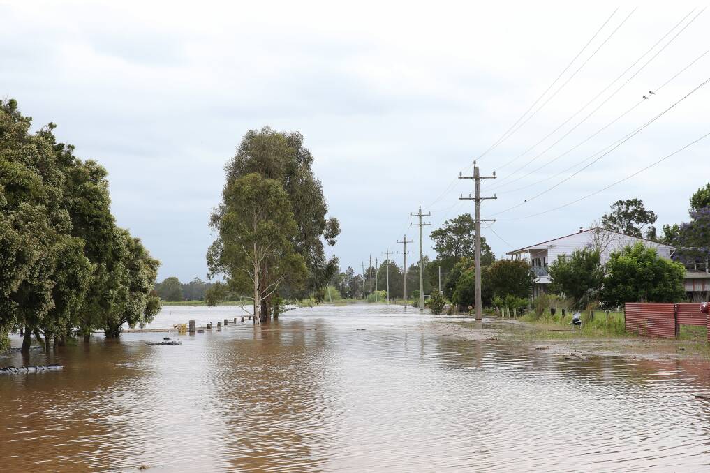 Flooding at Hinton on the Paterson River following the recent deluge keep SES volunteers busy with calls for assistance. Pictures Peter Lorimer