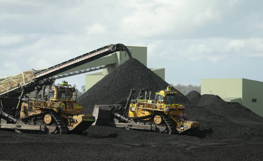 Coal being loaded onto trucks at Muswellbrook's Mt Pleasant coal mine. Picture: Jonathan Carroll
