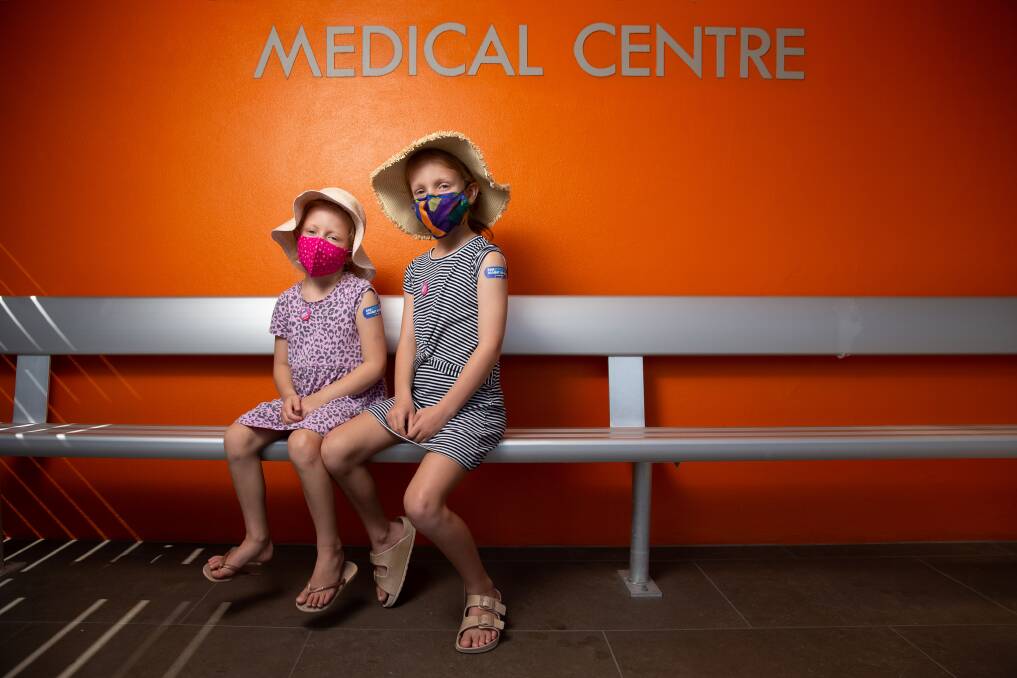 FIRST JAB: Violet and Lucy Roberts at Hamilton Doctors where they became some of the first children aged between 5 and 11 across the country to receive their first COVID-19 vaccinations on Monday. Picture: Marina Neil
