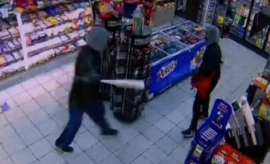 VIOLENT: The father and son during an armed robbery at a Williamtown service station in May, 2020.