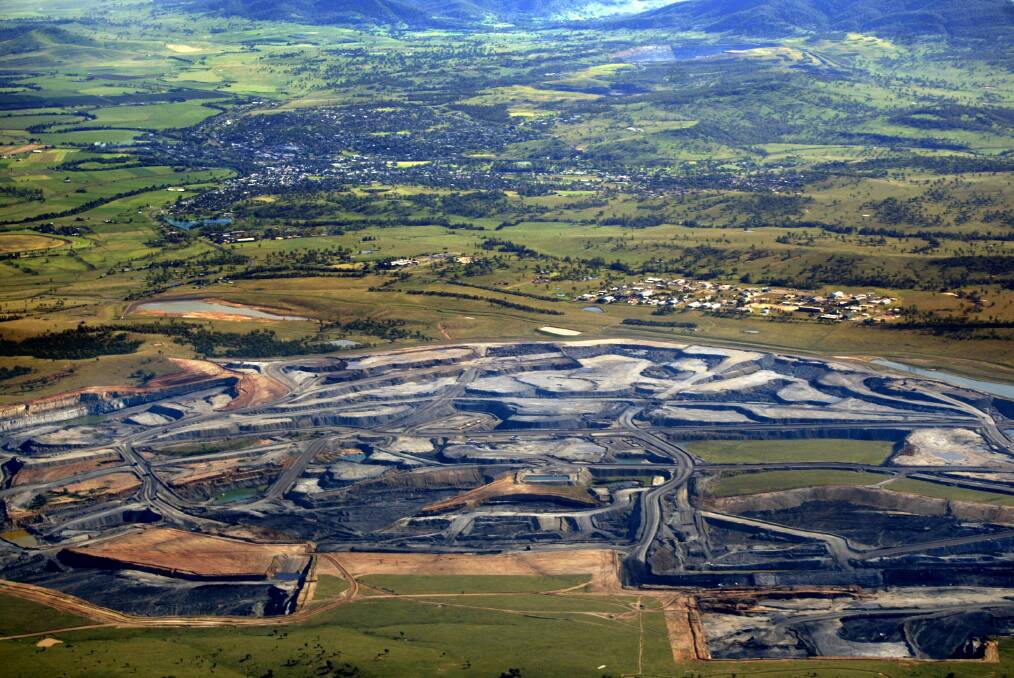 Mt Arthur Coal mine, with Muswellbrook in the background. BHP is closing the mine down, while plans to extend 15 other mines in the Upper Hunter are forging ahead.