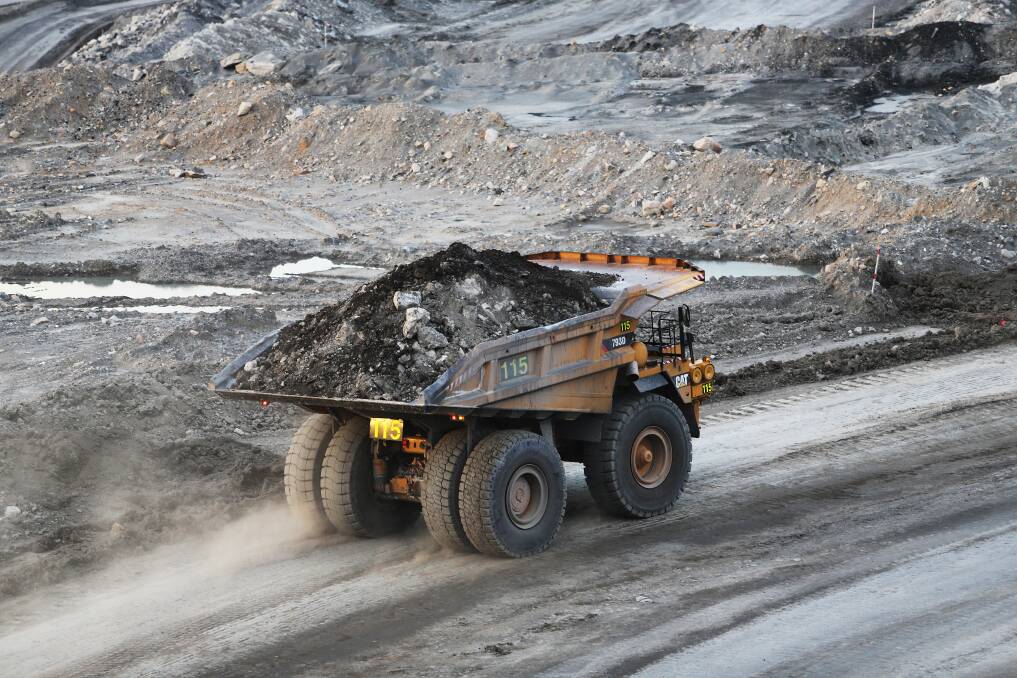 A dump truck in action at a Hunter Valley coal mine. Picture Peter Lorimer.