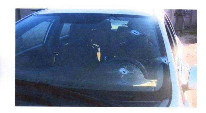 ARMED ATTACK: Bulletholes in the car Mr Zakhil's family travelled in as they fled Kandahar for Kabul where they now fear for their lives. Picture: Supplied