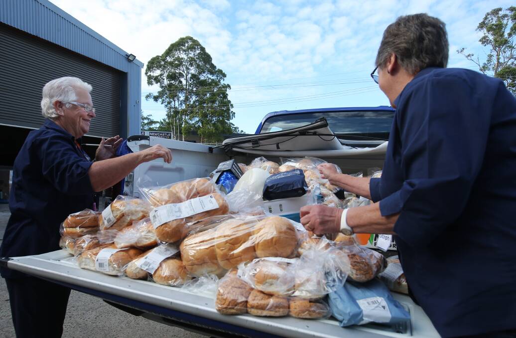 Sandra Eaves and Stephanie Turner of Survivor's R Us sort through food donations. Picture by Simone De Peak