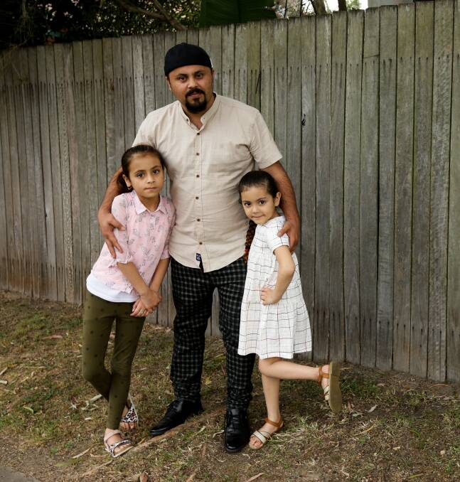 Fardin Rahmani, a former Afghan interpreter, with his daughters Mahdis and Freshta.