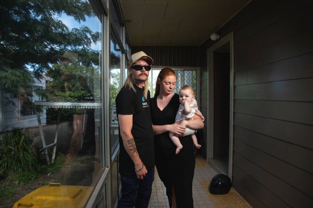 31-year-old Luke Rossington, with his partner Rebecca and their baby, Arleena, in the room from which his e-bike was stolen. Picture by Marina Neil.
