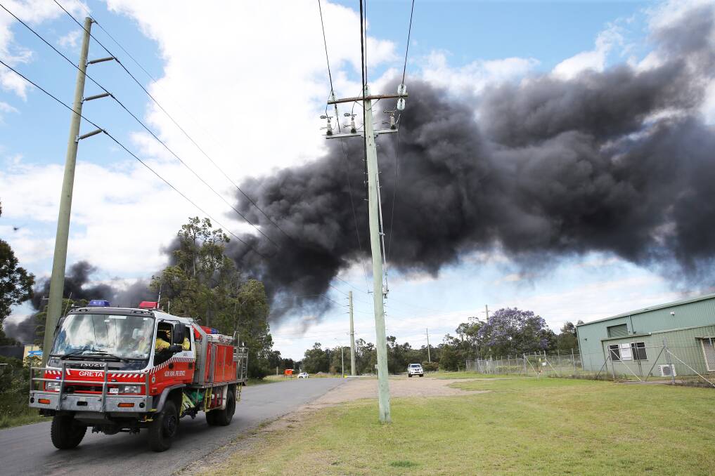 On-site at the fire in Mitchell Avenue, Kurri Kurri, which started with a pallet of hand sanitiser outside Weston Aluminium buildings about 10/40am on Sunday. Pictures: Peter Lorimer