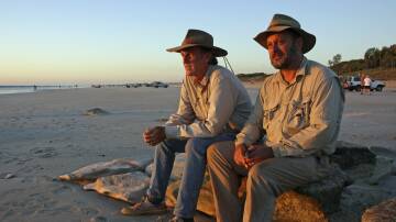 ON A MISSION: Tim Flannery pictured with John Doyle, aka Rampaging Roy Slaven, with whom he filmed a six-part series exploring Australia through a climate change lens, journeying from Cairns to Broome. Picture: Supplied
