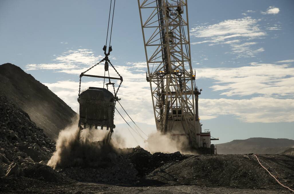 A dragline in operation at Hunter Valley Operations Lemington Road mine site. Picture by Marina Neil