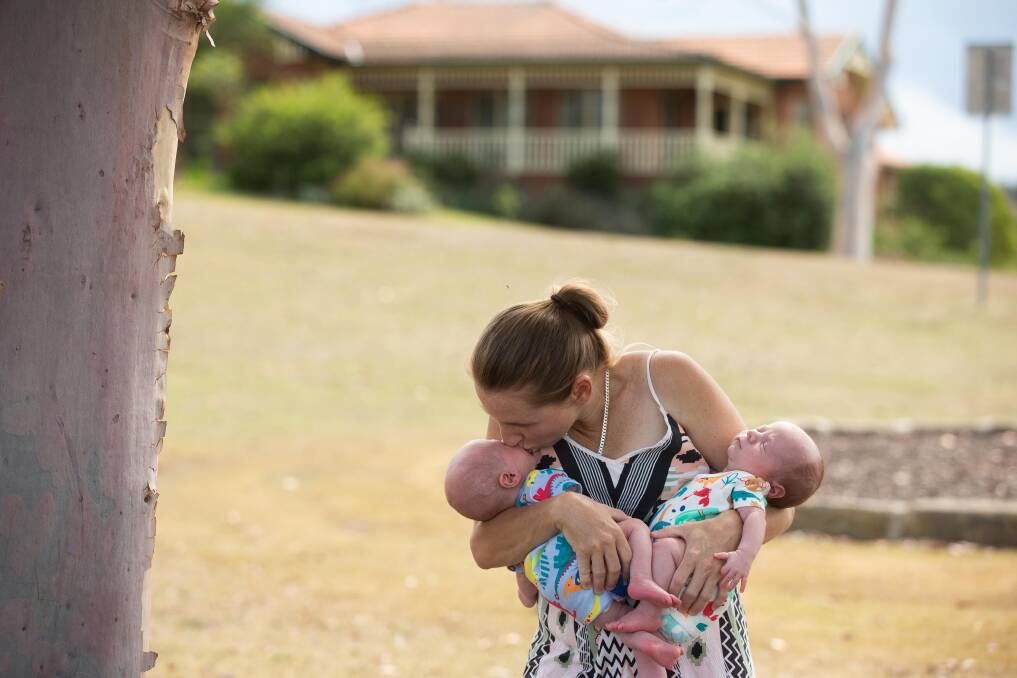 Muswellbrook mother-of-five Mary Wilkinson with her newborn twin boys. Jax (left) was born in the back of a moving ambulance en route to Maitland Hospital, where Logan was born 35 minutes later. Picture by Jonathan Carroll