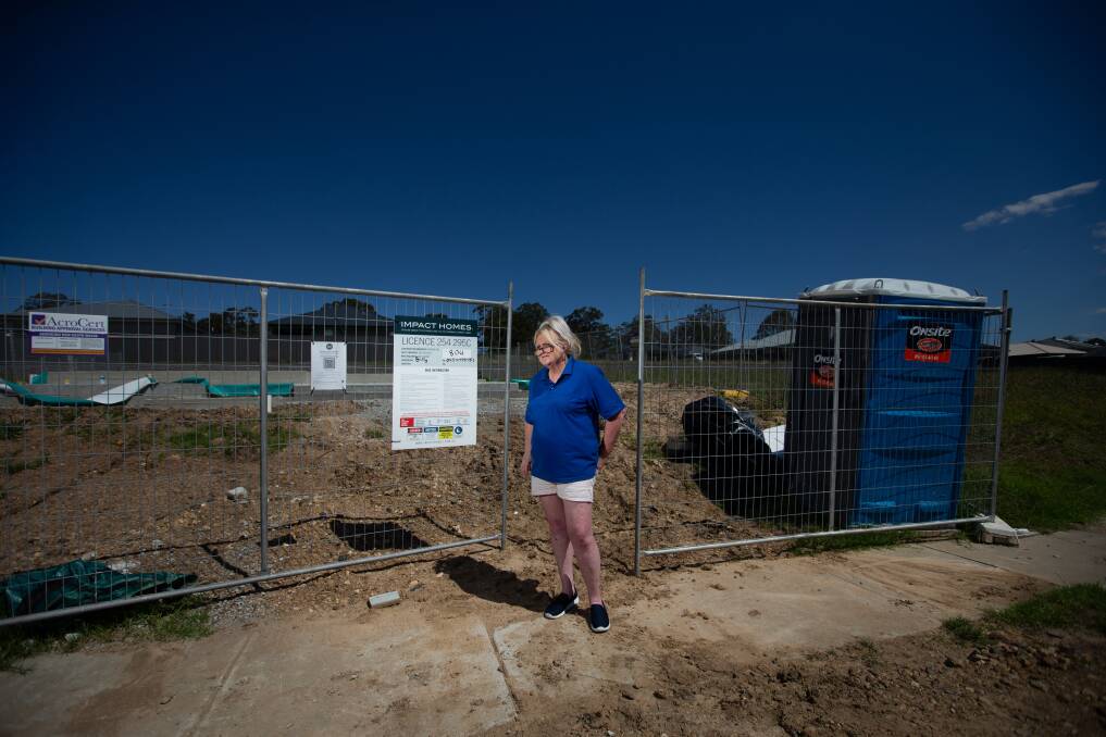 Nowhere to go: Sara Conlan at the abandoned site of her dreamed-of home at Raymond Terrace which has not got off the ground. Picture: Marina Neil