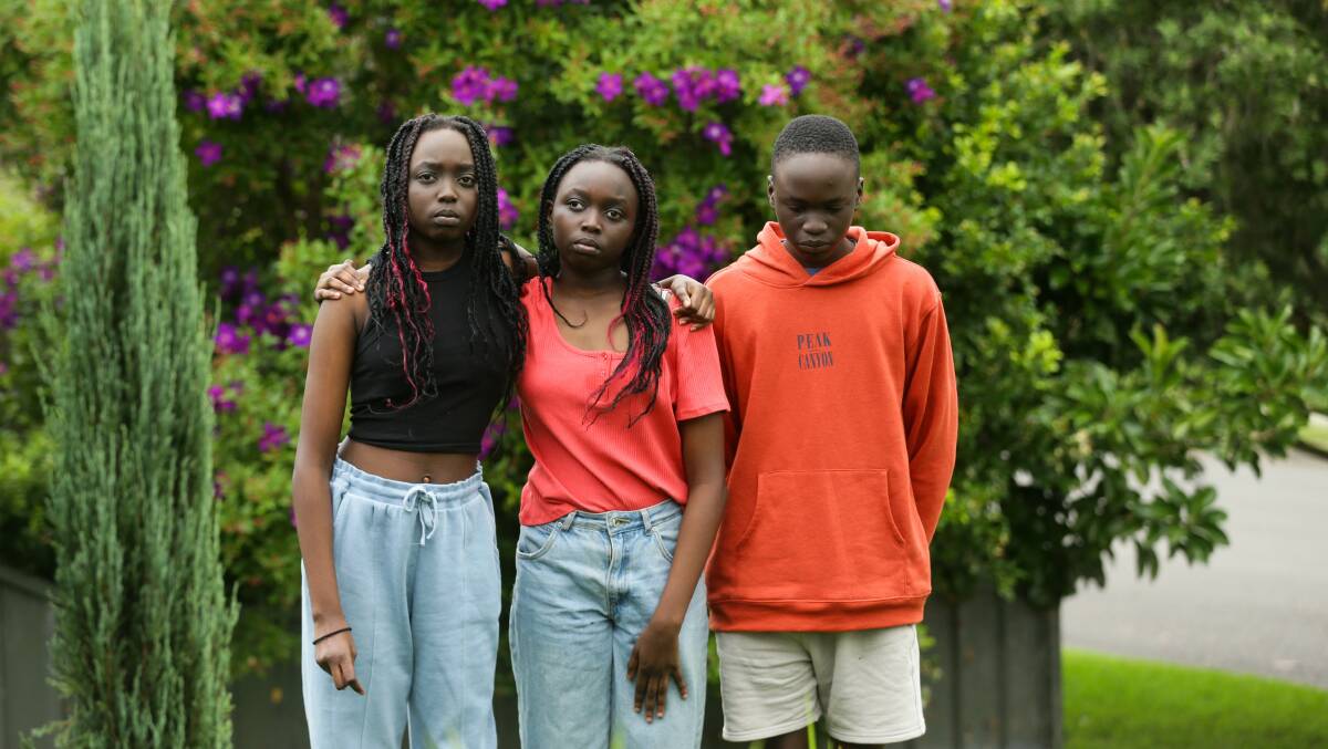 Akoi, Athiei and Beny Mayek say they feel isolated after speaking out about a school assignment. Picture: Jonathan Carroll