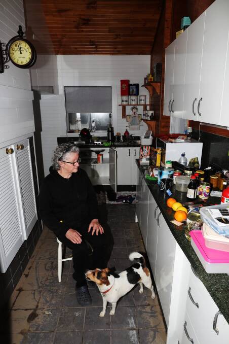 Displaced: Evelyn Hardy in her home largely ruined by the July floods.