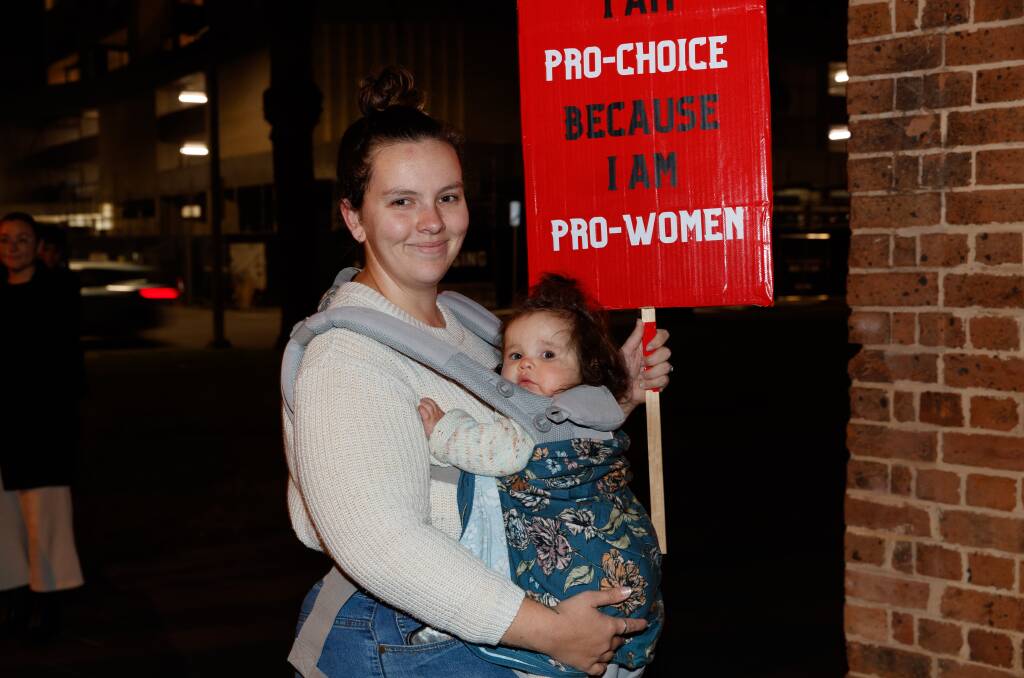 25-year-old mother Sabrina Carrall was at the rally with her 10-month-old daughter Audrey. Picture: Max Mason-Hubers
