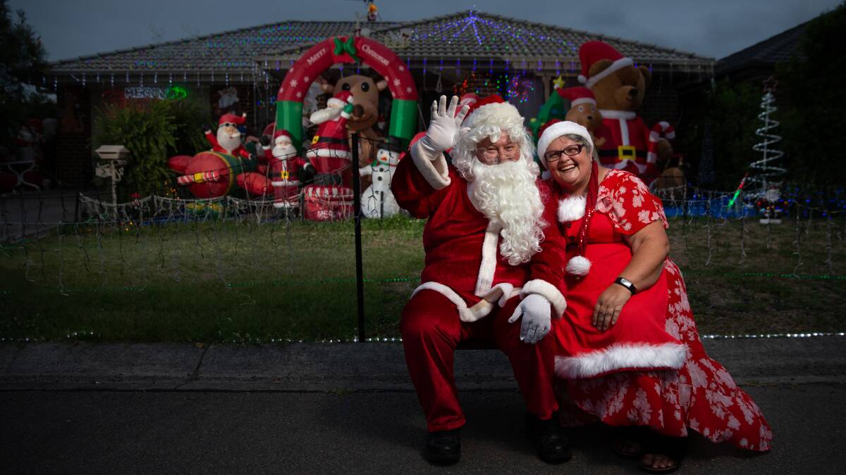 Santa Spirit: Grant and Bella Johnston of Rutherford offer free Santa photos, letters and treat bags every year to give back to the community. Picture: Marina Neil.