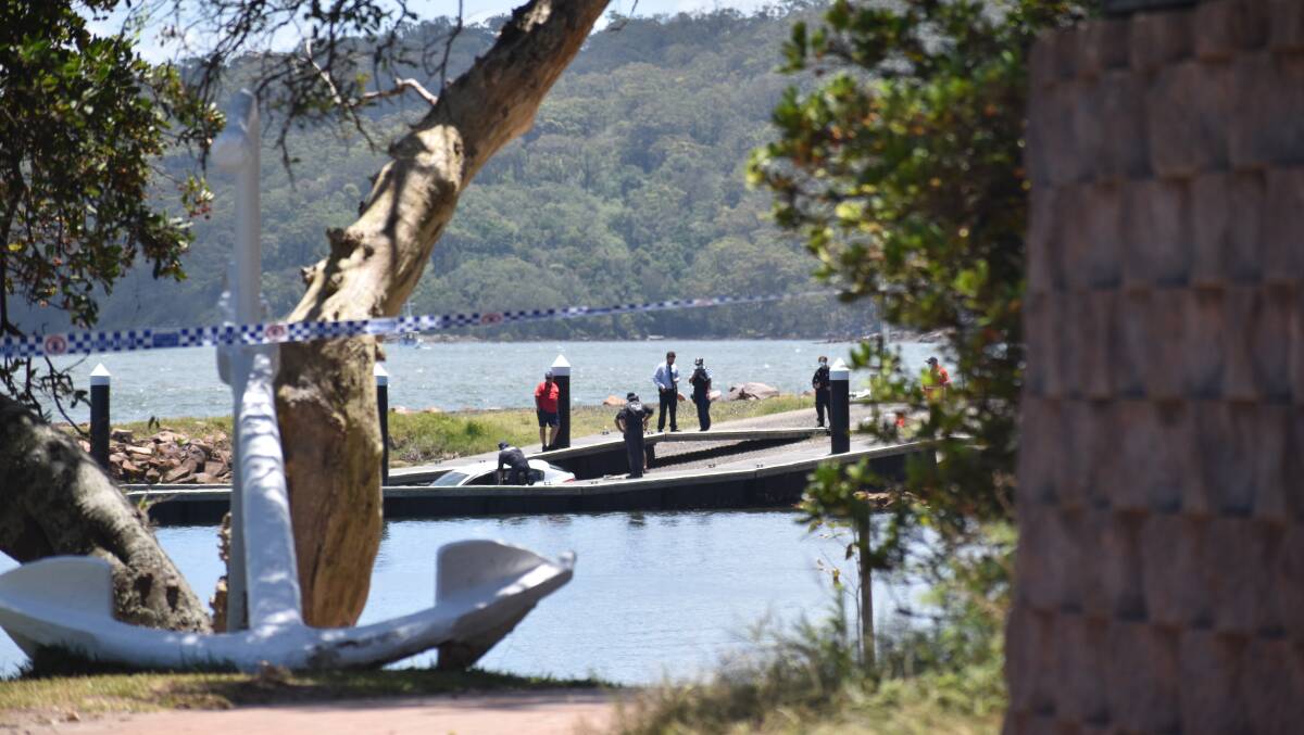 Two bodies have been recovered along with a hatchback from Soldiers Point boat ramp. Picture: Ethan Hamilton.