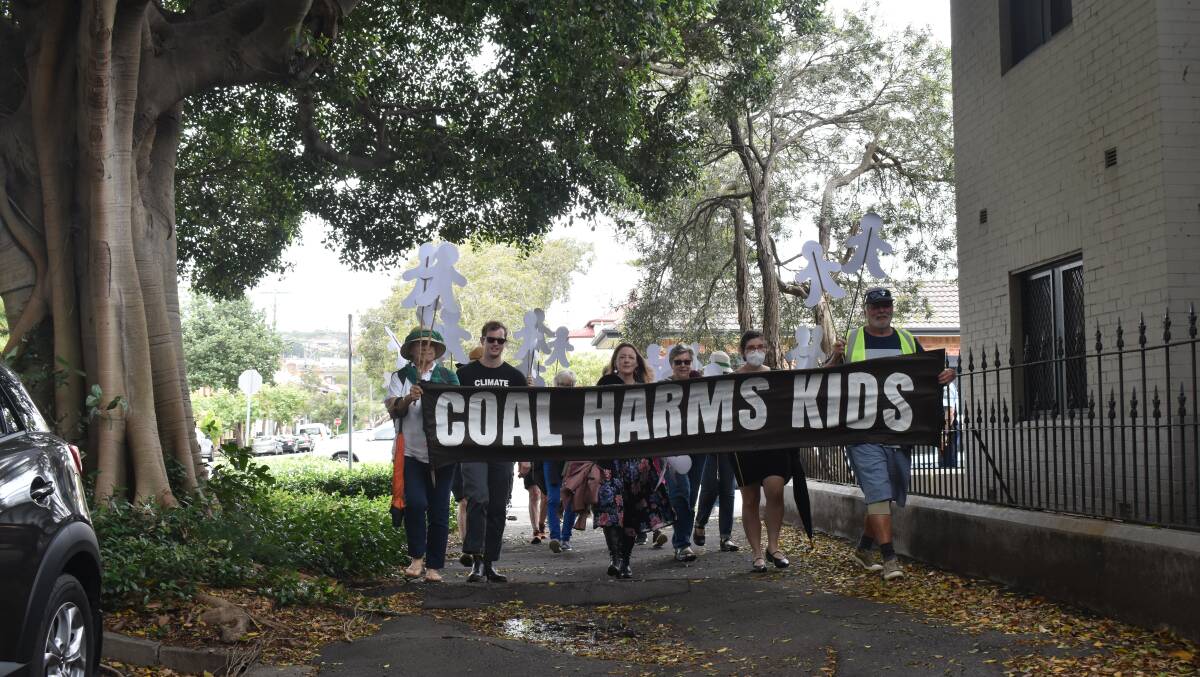 Clean air: Advocates gathered in Centennial Park, Cooks Hill, on Wednesday before marching to the EPA offices demanding action on Vales Point exemption. Pictures: Ethan Hamilton.