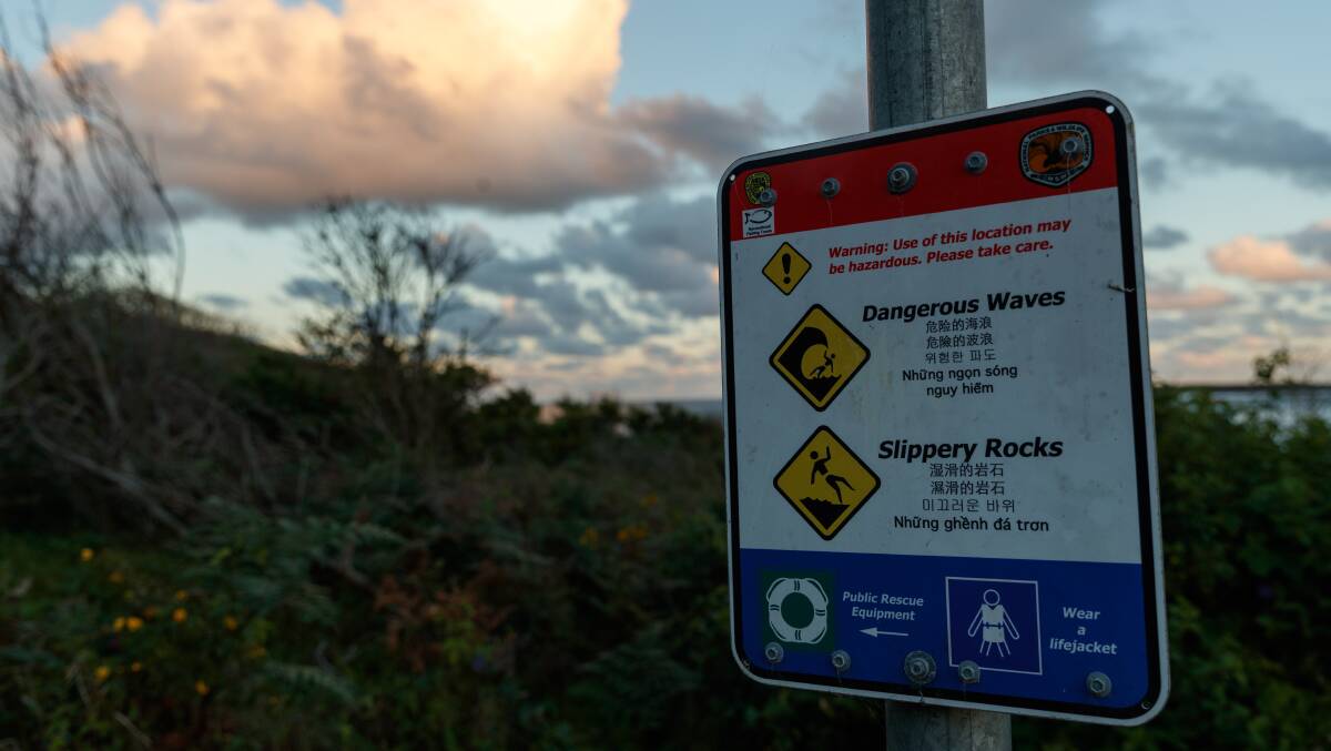 Warning signs at Catherine Hill Bay's Pink Caves. Pictures: Max Mason-Hubers
