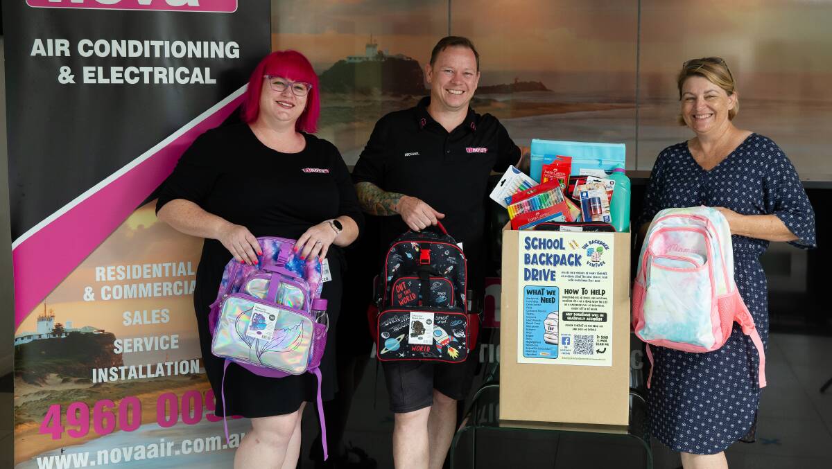 School Essentials: Nova staff and siblings, Karen and Michael Sherwell, donating backpacks collected at their site to The Backpack Venture's Catherine Woodbine (right). Picture: Marina Neil. 
