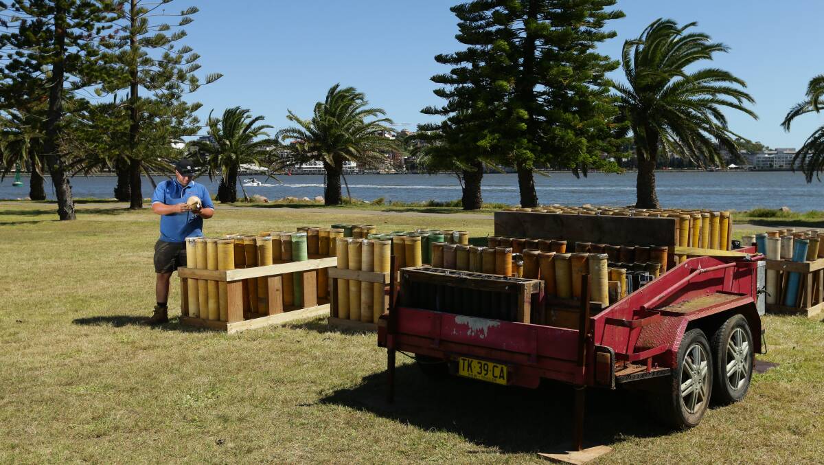 Out with a bang: Brandon Collins of The Fireworks Factory setting up on Stockton foreshore for Newcastle's New Year's Eve 9pm display. Picture: Jonathan Carroll