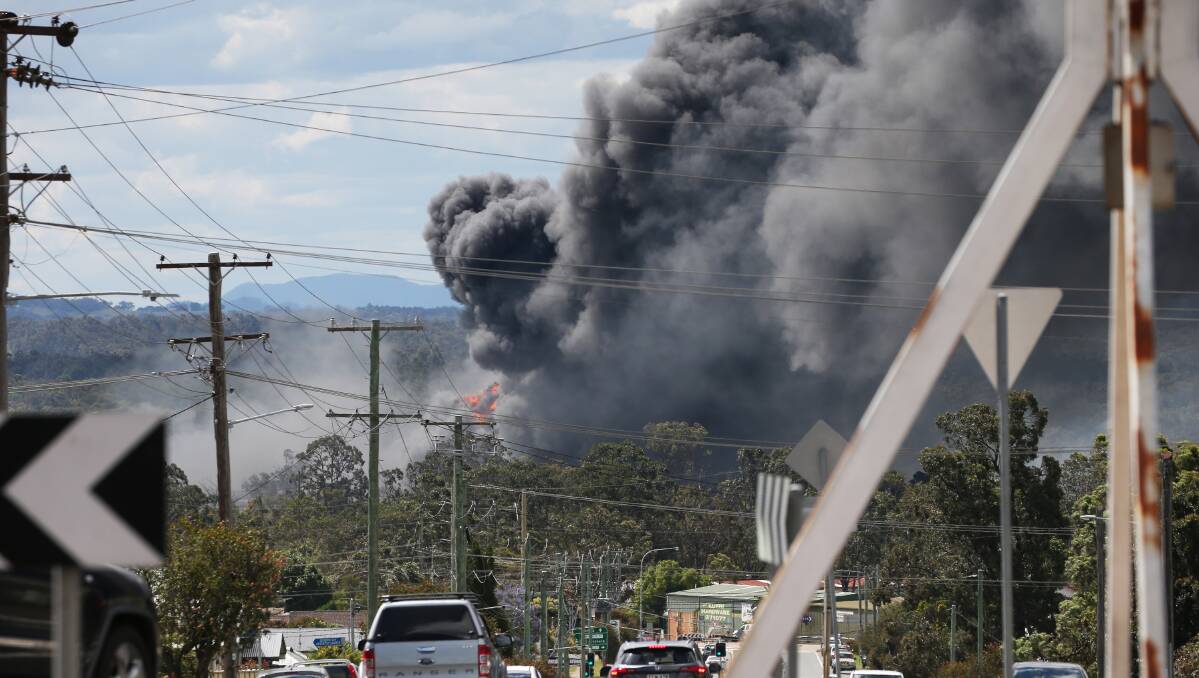 Ablaze: Smoke from the Weston Aluminium fire blanketed Kurri Kurri on Sunday. Picture: Peter Lorimer