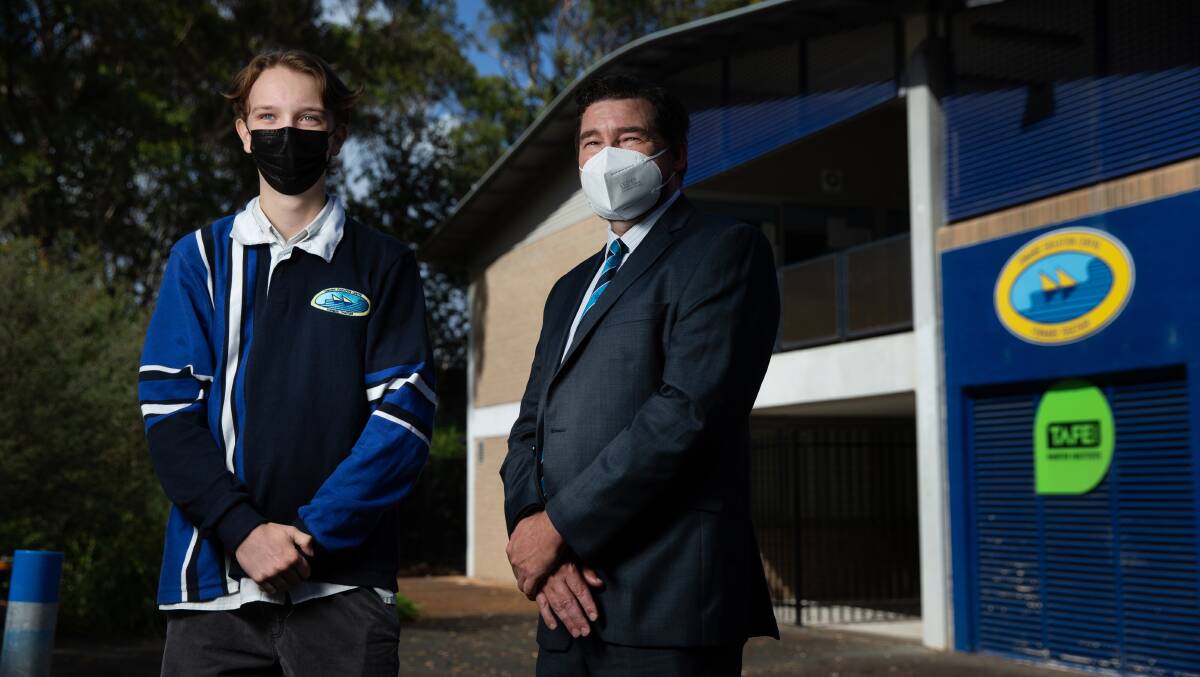 Back to school: Tomaree High School principal Paul Baxter and captain Cooper Lack are becoming accustomed to the testing, distancing and mask-wearing requirements following the first school week of 2022. Picture: Marina Neil