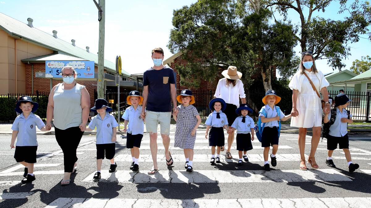 The twins ready for school at St Therese's with parents Angela Milek, Damien Jones, Natasha Perry, Sarah Sylvester. Picture: Peter Lorimer 