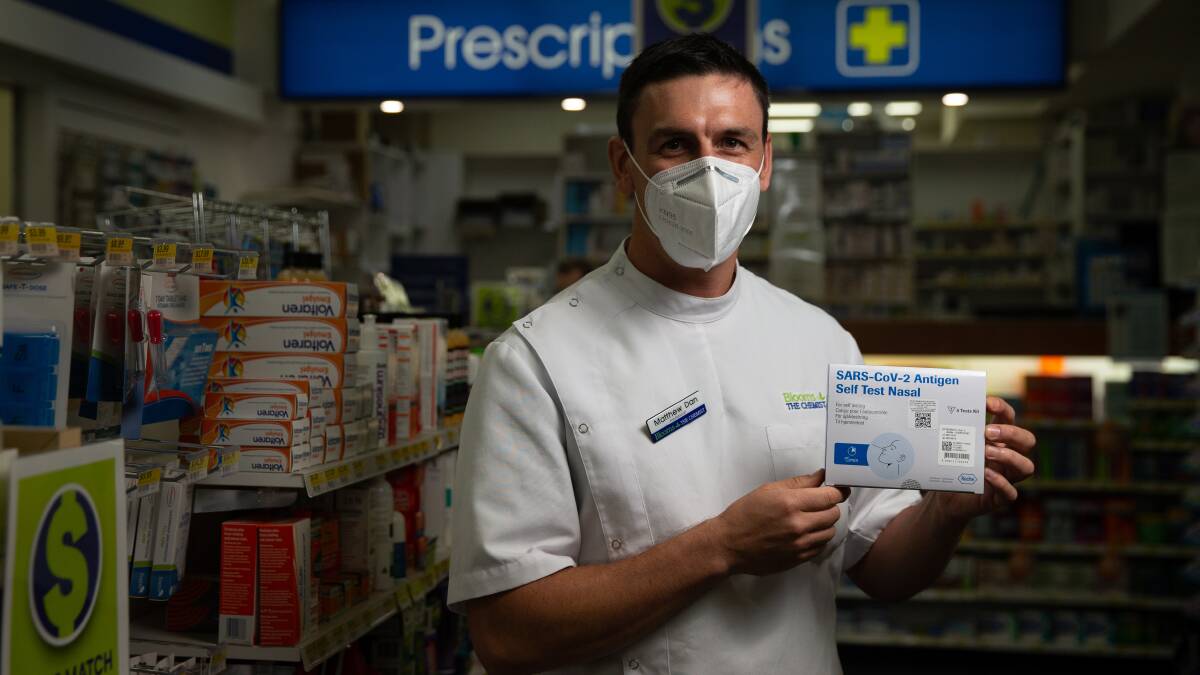 Hot cakes: Matthew Dan at Blooms the Chemist Mayfield is one of the few pharmacists in the area with Rapid Antigen Tests in stock. Picture: Marina Neil.