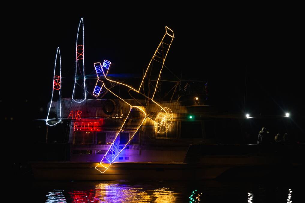 Lit: Marine vessels of all descriptions were decked out in light and colour for the first night of Lake Macquarie's Float Your Boat 2022. Pictures: Marina Neil