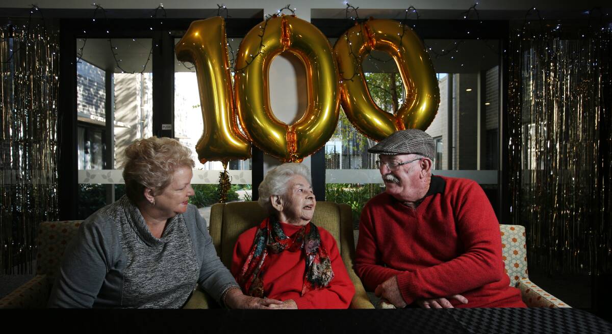 Centenarian: Marian Brunt, centre, with daughter-in-law Rae and son David, celebrated her 100th birthday on Monday. Picture: Simone De Peak