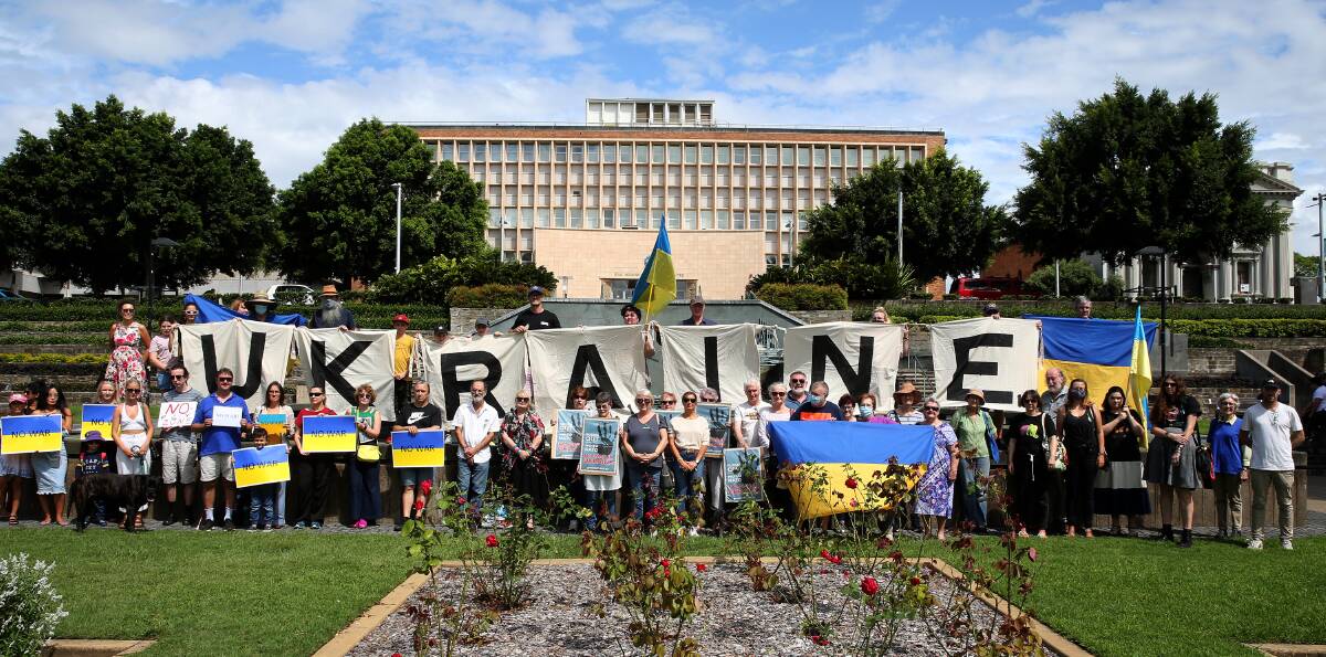 A range of voices unite in Civic Park calling for an end to Ukraine conflict. Picture: Peter Lorimer
