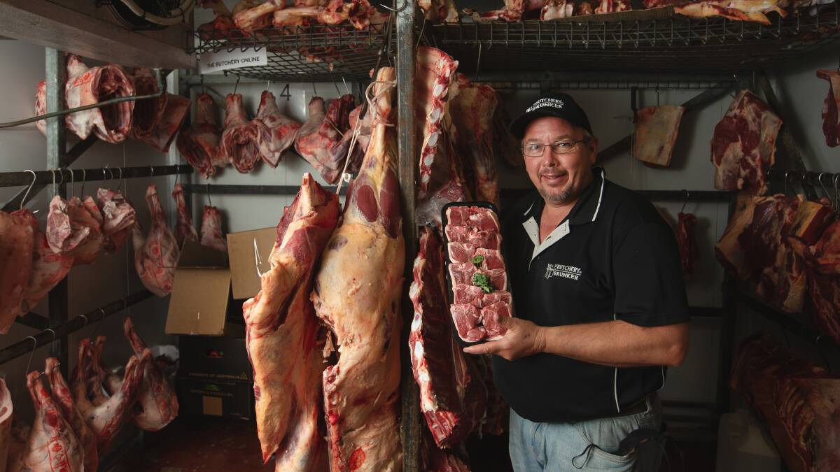 Fully stocked: Rob Owen from The Butchery on Brunker shows off a meat cooler full of fresh produce as larger chain stores feel the pinch of supply shortages. Picture: Marina Neil. 