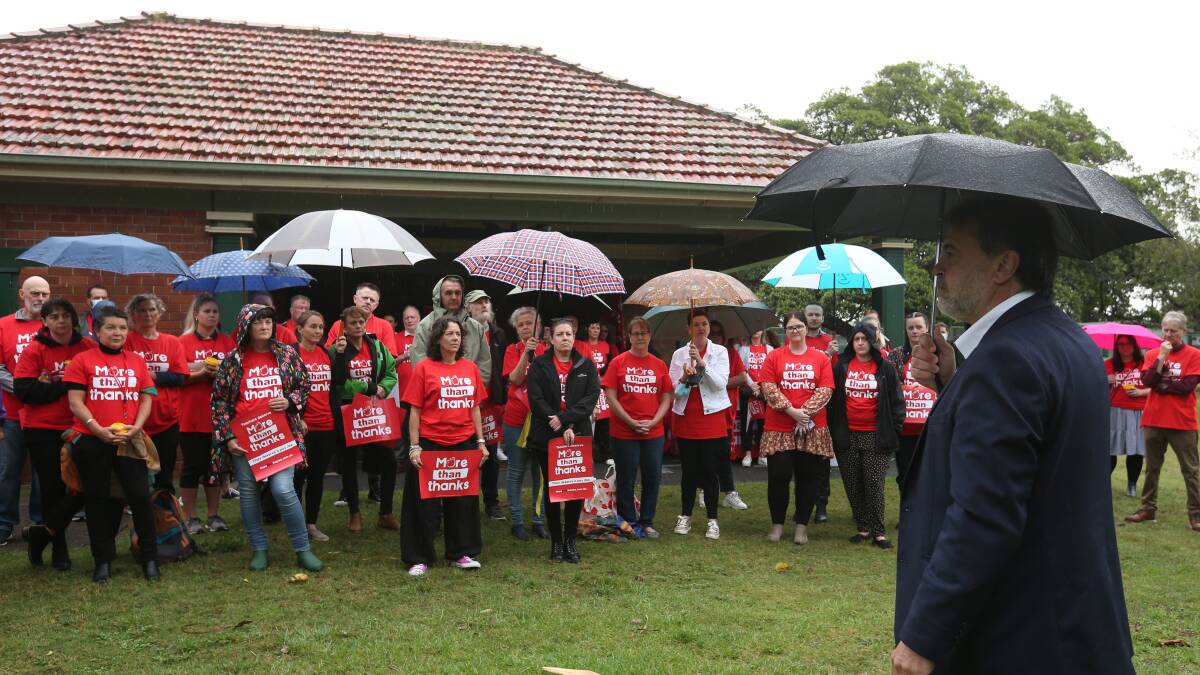 Dedicated: NSWTF president Angelo Gavrielatos addressing teachers in the rain at Gregson Park, Hamilton. Picture: Simone De Peak