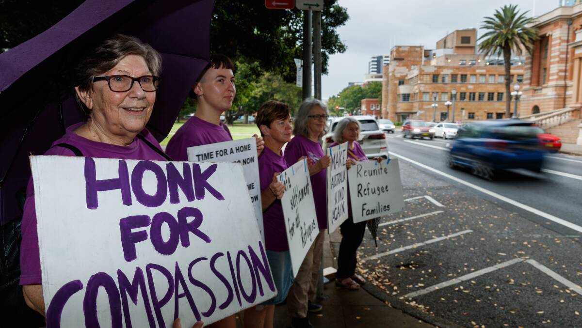 Honk for Compassion: Marion Gevers with Grandmothers for Refugees members at their usual spot opposite Newcastle City Hall. Picture: Max Mason-Hubers. 