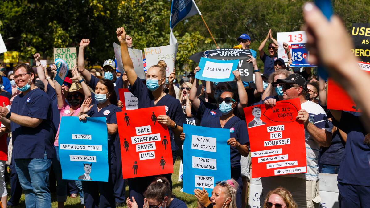 Hunter Nurses and Midwives joined state-wide strikes on Tuesday and held a protest rally in Civic Park demanding working ratios and fair pay. Pictures: Max Mason-Hubers