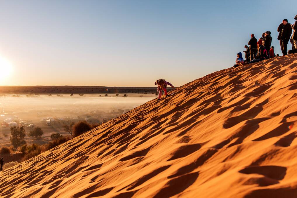 On the big red dune at Birdsville. Picture: Tourism and Events Queensland