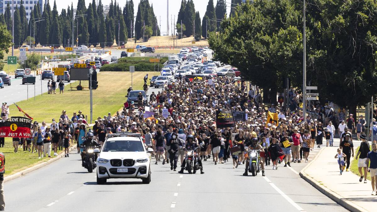 Canberra's Sovereignty Day protesters march over Commonwealth Avenue Bridge on their way to The Aboriginal Tent Embassy. Picture by Keegan Carroll