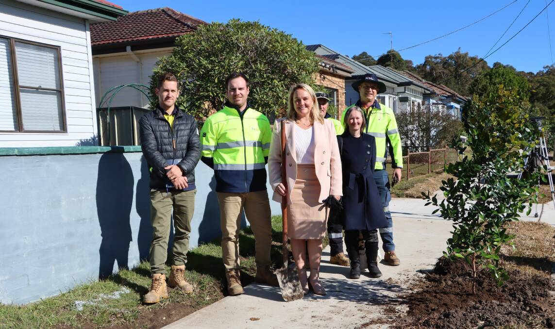 Upgrades: Lord Mayor Nuatali Nelmes tree planting with City of Newcastle project team members on the new footpath on Freyberg Street. Picture: Supplied 