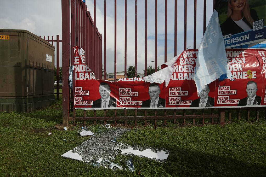 Destroyed: Liberal party signs were burnt at Rutherford High School. Picture: Simone De Peak 